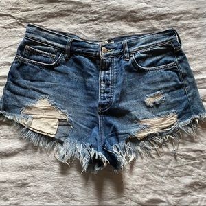 Distressed and frayed Free People denim shorts